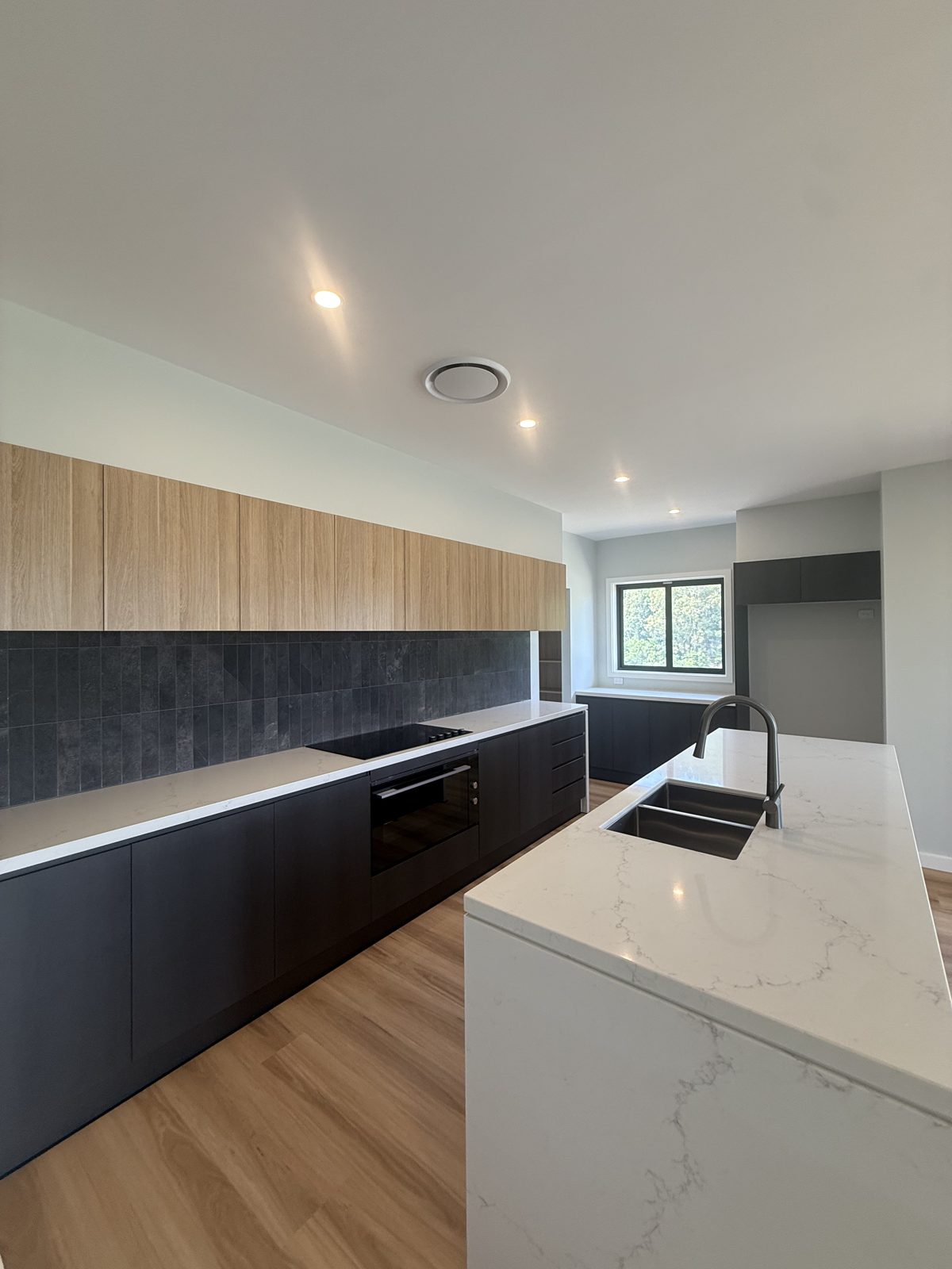 Kitchen island downlights installed by Cozlec