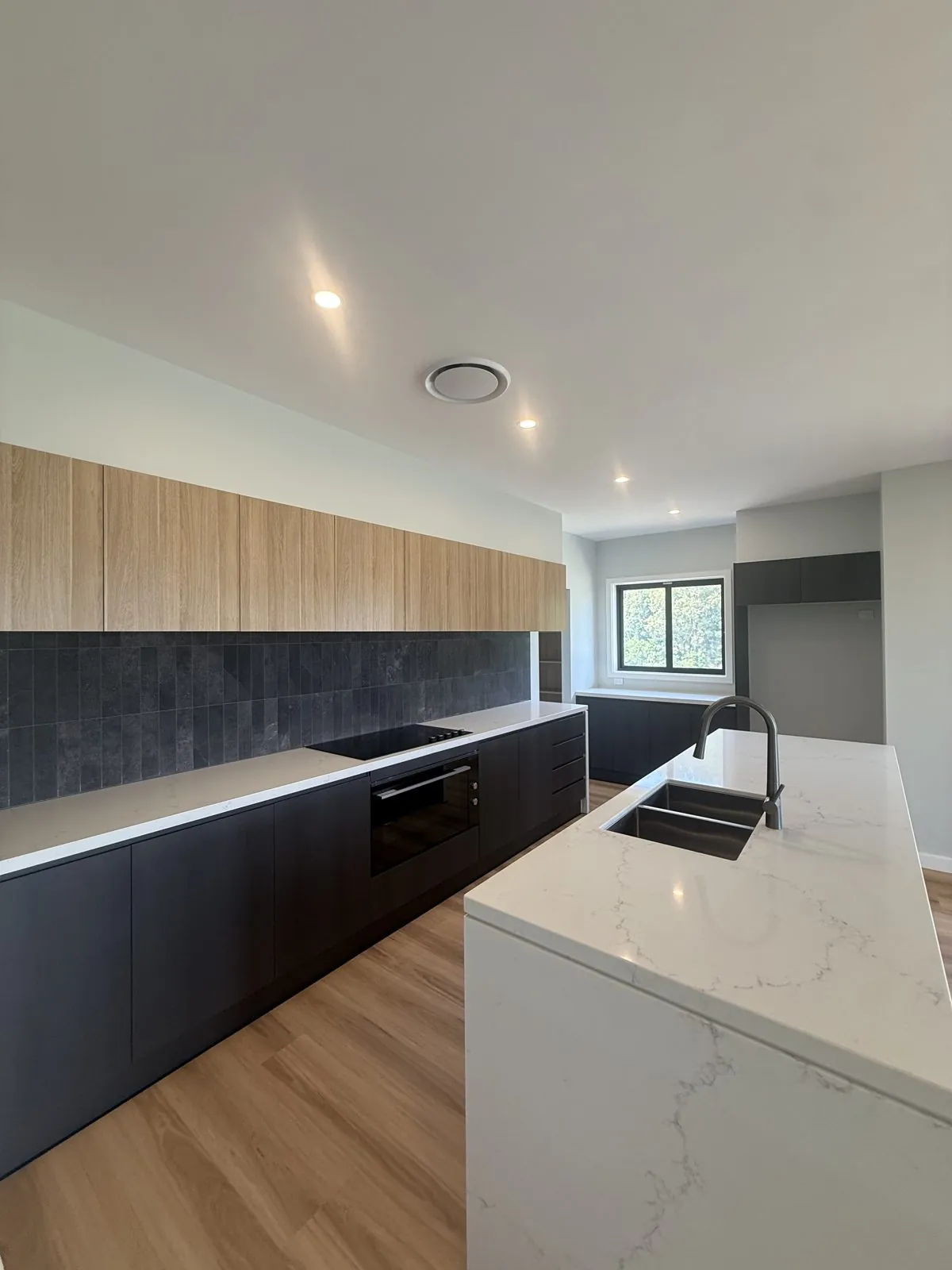 Kitchen island downlights installed by Cozlec